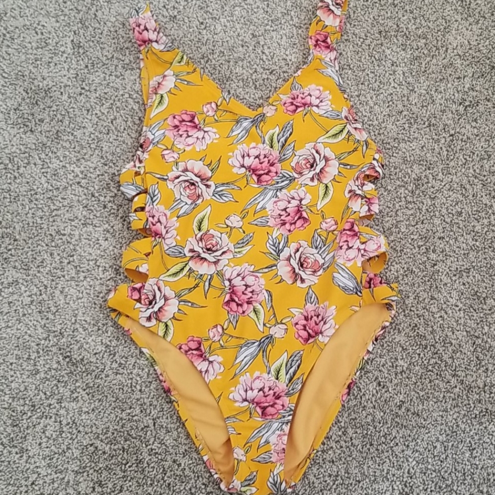 Yellow swimsuit with cutouts on side